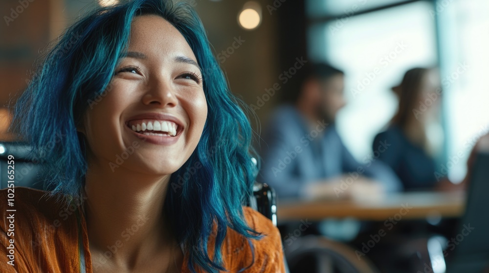 Poster A person with bright blue hair sits comfortably in a wheelchair, smiling at the camera