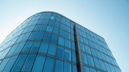 Modern Building with Curved Glass Facade Reflecting Sky &ndash; Contemporary Architectural Design, Sleek Glass Exterior, and Minimalist Urban Skyscraper