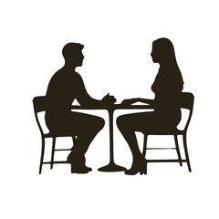 A young Caucasian man and woman sitting at a table, engaged in conversation