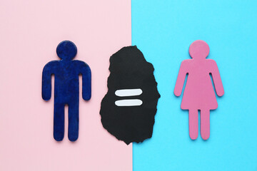 Gender equality concept. Male and female figures on color background, flat lay