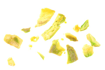 Naklejka premium Pieces of peeled pistachio nut isolated on white