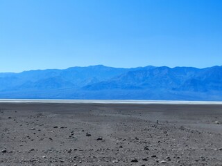 death valley landscape, salt lake view, panorama, people silhouette in the distance