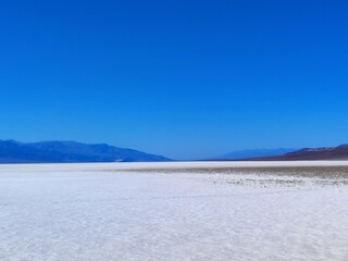 death valley landscape, salt lake view, panorama, people silhouette in the distance