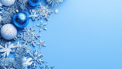 A snowflake and ball background with a blue Christmas theme