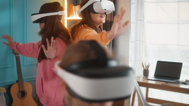 Teenager friends, only girls having fun playing video multiplayer games wearing virtual reality headsets in neon room at home