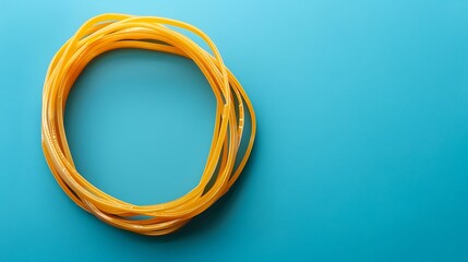 Naklejka premium A group of rubber bands arranged in a circle on a solid blue background