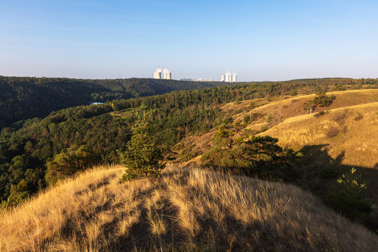 Landscape around Dukovany nuclear power plant. In the foreground, the Mohel steppe and a valley with a water reservoir.