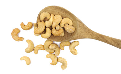 Salted cashew nuts in wooden spoon isolated on white background, top view