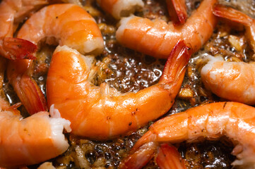 fried red shrimp in a pan, cooking fish dishes, fish food, selective focus, background