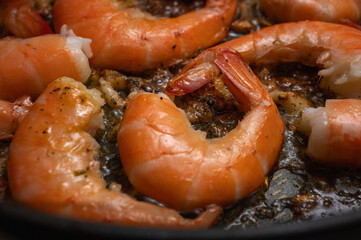 fried red shrimp in a pan, cooking fish dishes, fish food, selective focus, background