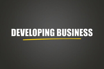 Developing Business. A blackboard with white text. Illustration with grunge text style.