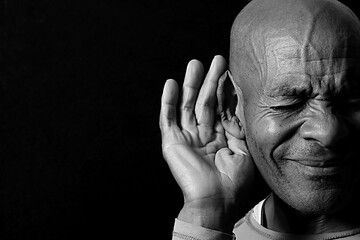 deaf man suffering from deafness and hearing loss on grey background with people stock image stock...