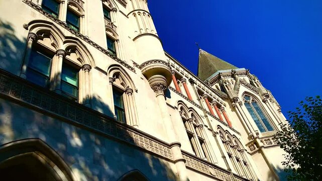 The Royal Courts of Justice Courthouse at Strand main street, Gothic style building facade, central London ENGLAND UK