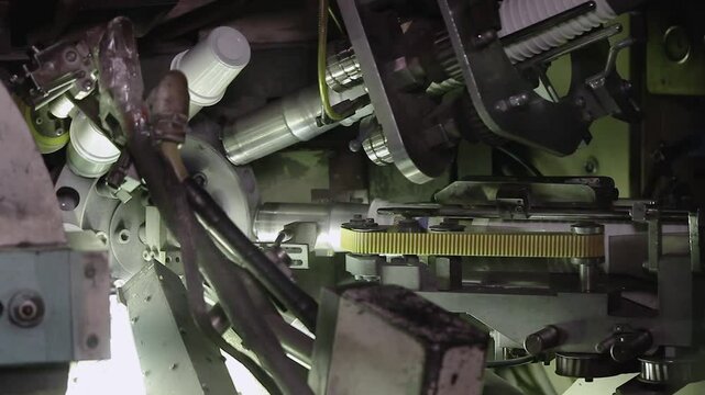 Labeling plastic food containers. High speed labeling machine in industrial factory. Machine for sticker on product in manufacture. Flexible packaging. Labeling machine in industrial factory.