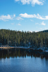 Fototapeta premium Veltfiskelausen Lake from the northern part of the Svartdalstjerna Forest Reserve of the Totenåsen Hills, Norway, in fall.