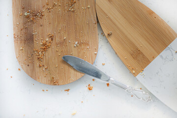 Empty board with bread crumbs and knife. Food and cutlery. The concept of hunger. no food. food crisis