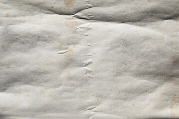 Crumpled Old weathered paper with folded crease