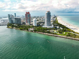 Naklejka premium Miami Beach scene from drone, Florida, USA. Miami seaside. Aerial view of Miami Beach and cityscape. Coastline of Miami Beach, aerial view. Famous American landmarks.