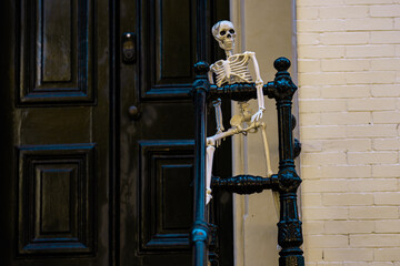 Halloween skeleton. Halloween pumpkin and skeleton for decorated house. Scary Decorated at front yard of a American home. Trick or treat. Halloween background. Autumn holiday of Halloween.