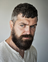 Obraz premium Portrait of the handsome man. A Hipster guy model headshot. Male face. Bearded handsome man. Confident male model. Man looking proud. Closeup face of attractive man. Beard and moustache.