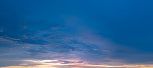Obraz premium Panoramic sunrise or sunset sky with clouds. Sunset Sky on Twilight in the Evening with Sunset. Cloud Nature Sky Backgrounds. Sky Sunrise, Dusk clouds.