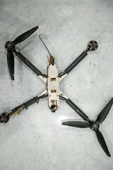 Downed enemy drone on black background
