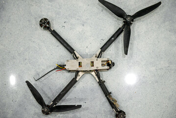 Downed enemy drone on black background
