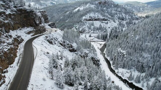 Winter Drone Flight Over Mountain Road To Green Bridge In Red Cliff Colorado 