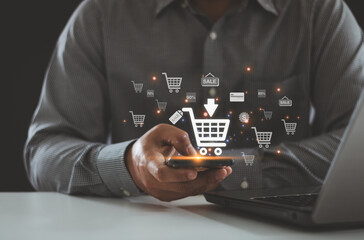 Online shopping business with selecting shopping cart. Business ecommerce concept. Person use smartphone and laptop with online shopping cart icon on virtual screen. online purchase, ecommerce store.