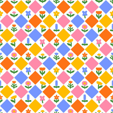 Fototapeta Colorful abstract flower art seamless pattern illustration. Checkered nature floral background in vintage style. Spring season mosaic tile decoration texture, geometric checker drawing print.