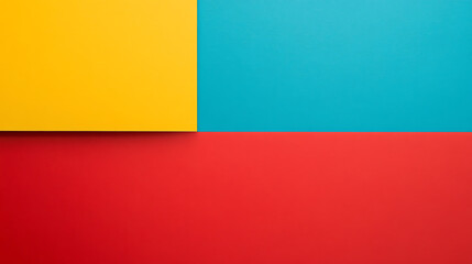 Obraz premium A vibrant arrangement of colorful papers in yellow, blue, and red, creating a modern and playful abstract background design.