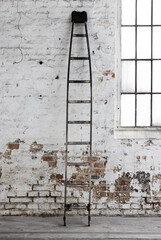 old ladder on wall © Agata Carr