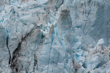 Close up view of Aialik Glacier landscape in Kenai Fjords National Park leading to the Harding Icefield near Seward, Alaska - blue glacier texture 