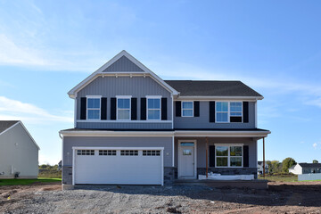 New Home Under Construction with Lumber Framing and Carpentry Builders Craftsman