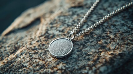 Elegant Silver Pendant on Textured Stone Background