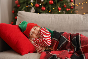 Cute little elf sleeping at home on Christmas eve
