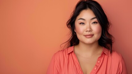 Fototapeta premium Positive Plus-Size Asian Woman on Colorful Background