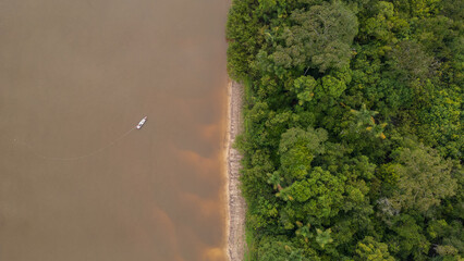 NANAY RIVER IN THE PERUVIAN JUNGLE, A LARGE AND COLORFUL BLACK WATER RIVER IN THE DEPTHS OF THE...