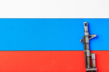 Automatic rifle on the flag of the Russian Federation or Russia. Symbolic background or backdrop