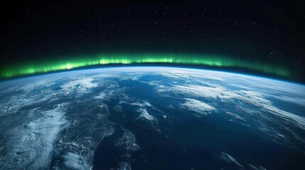Obraz premium A stunning view of Earth from space with the aurora borealis in the distance.