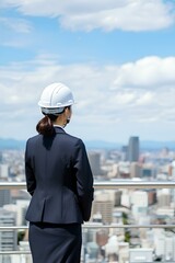 ビジネス・女性・ヘルメット・青空・背中｜Business, women, helmet, blue sky, back