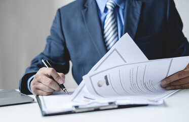 Business man employer holding resume hiring recruit looking cv resume to hire candidates, analyzing...