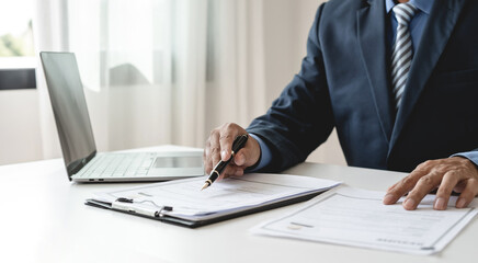Business man employer holding resume hiring recruit looking cv resume to hire candidates, analyzing...