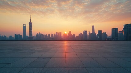 Empty asphalt square and Shanghai skyscrapers at sunset
