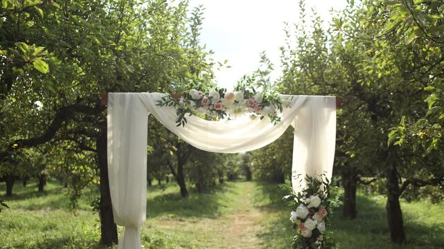 arch for a wedding ceremony in the park in summer among the trees