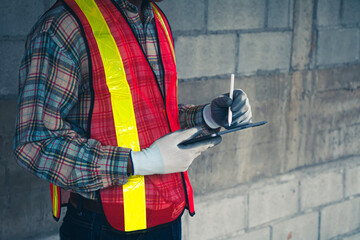 Quality inspection is streamlined as the engineer reviews data on the tablet.