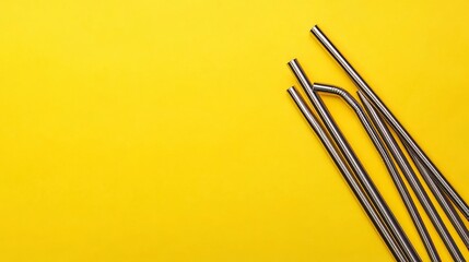 Naklejka premium Yellow background straw comparison.