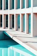 Fototapeta premium Modern Architecture by the Water: Clean lines and minimalist design of a contemporary building reflected in a turquoise pool. A study in architectural geometry and serene beauty. 