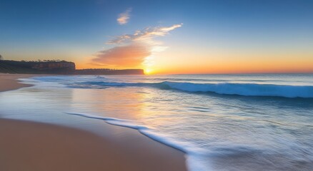 Obraz premium Serene sunrise over a tranquil beach with gentle waves and a glowing sky.