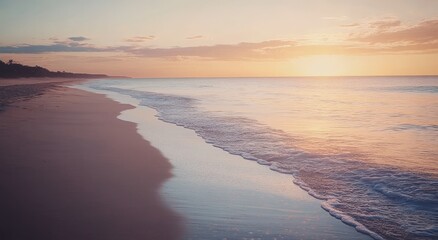 Serene sunset over a tranquil beach with gentle waves and a pastel sky, creating a peaceful and calming atmosphere.